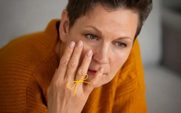 Yellowish bumps near her eyes, representing symptoms of high cholesterol.