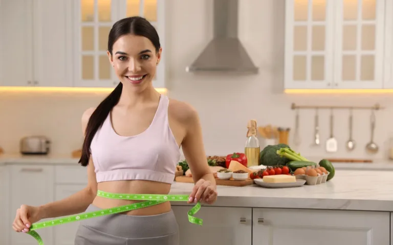 A woman in a sports bra measures her waist with a tape measure.