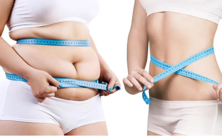 Two women using a tape measure to assess their waist measurements.