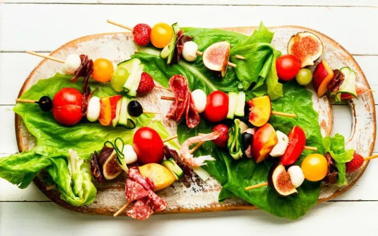 A plate featuring colorful skewers of grilled vegetables and meat