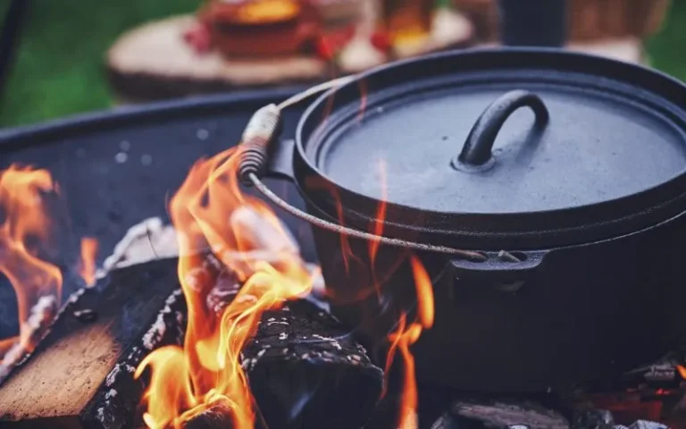 A pot on a stove with a lid, simmering over a flame.