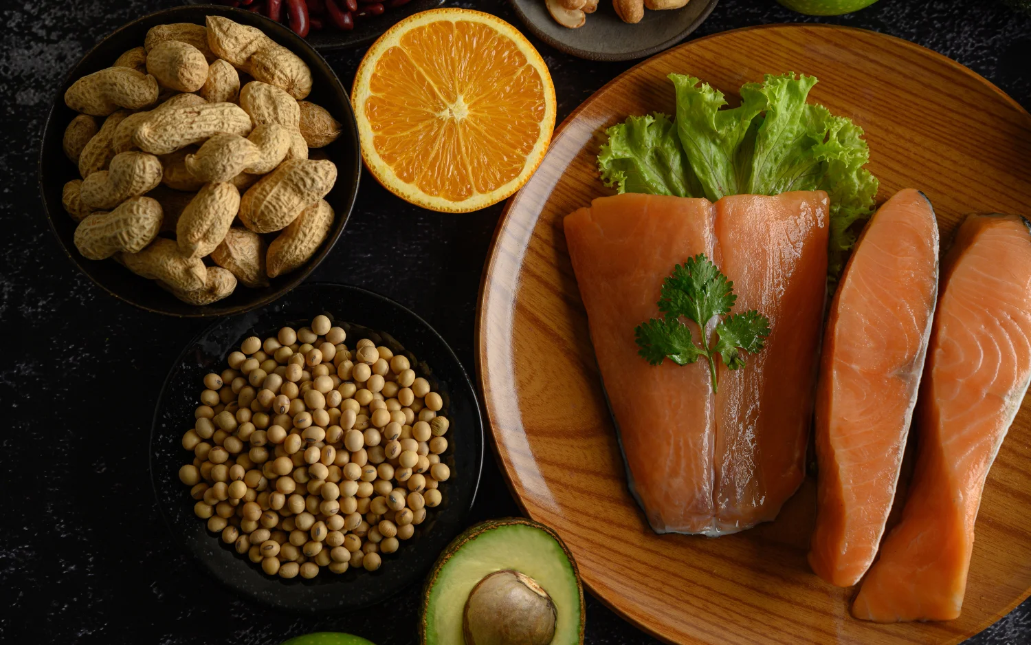 Nutrient-dense foods including salmon and nuts for heart health.